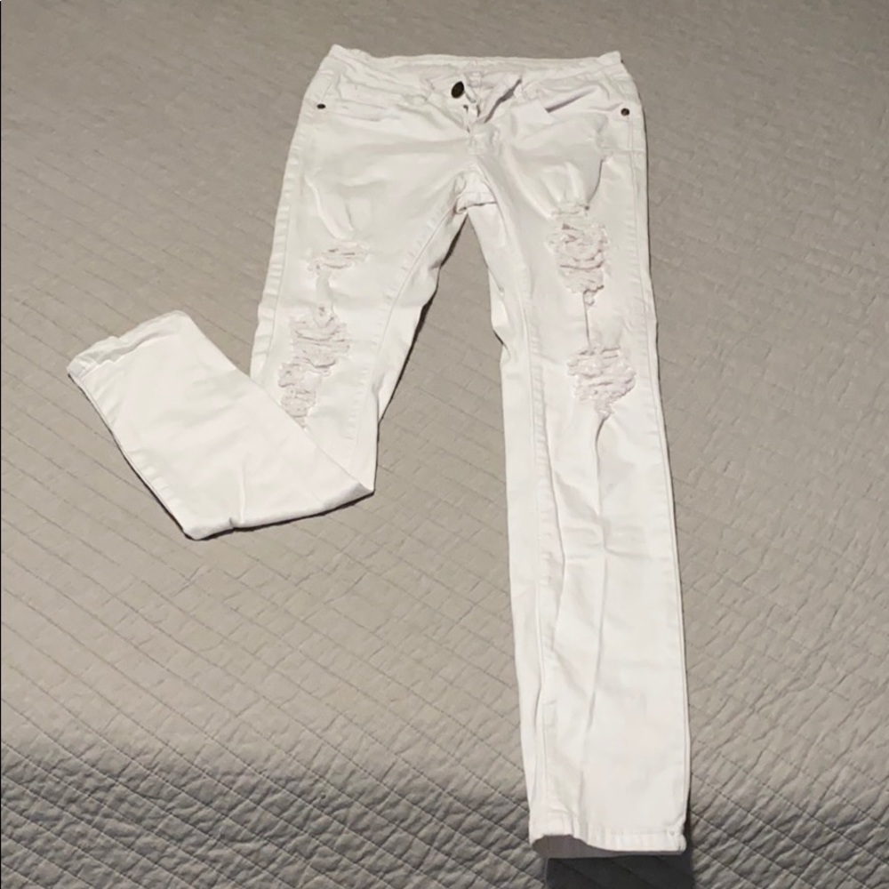 Distressed white jeans